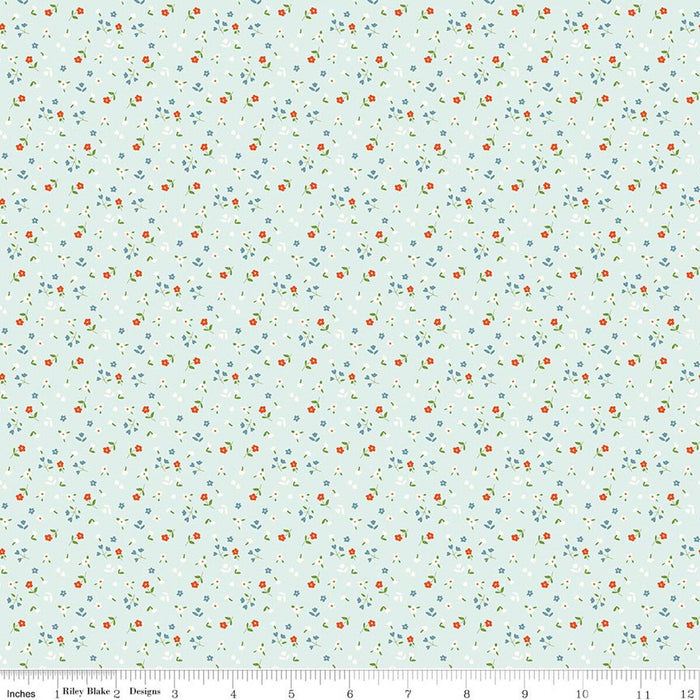 Floral pattern fabric swatch on a light blue background