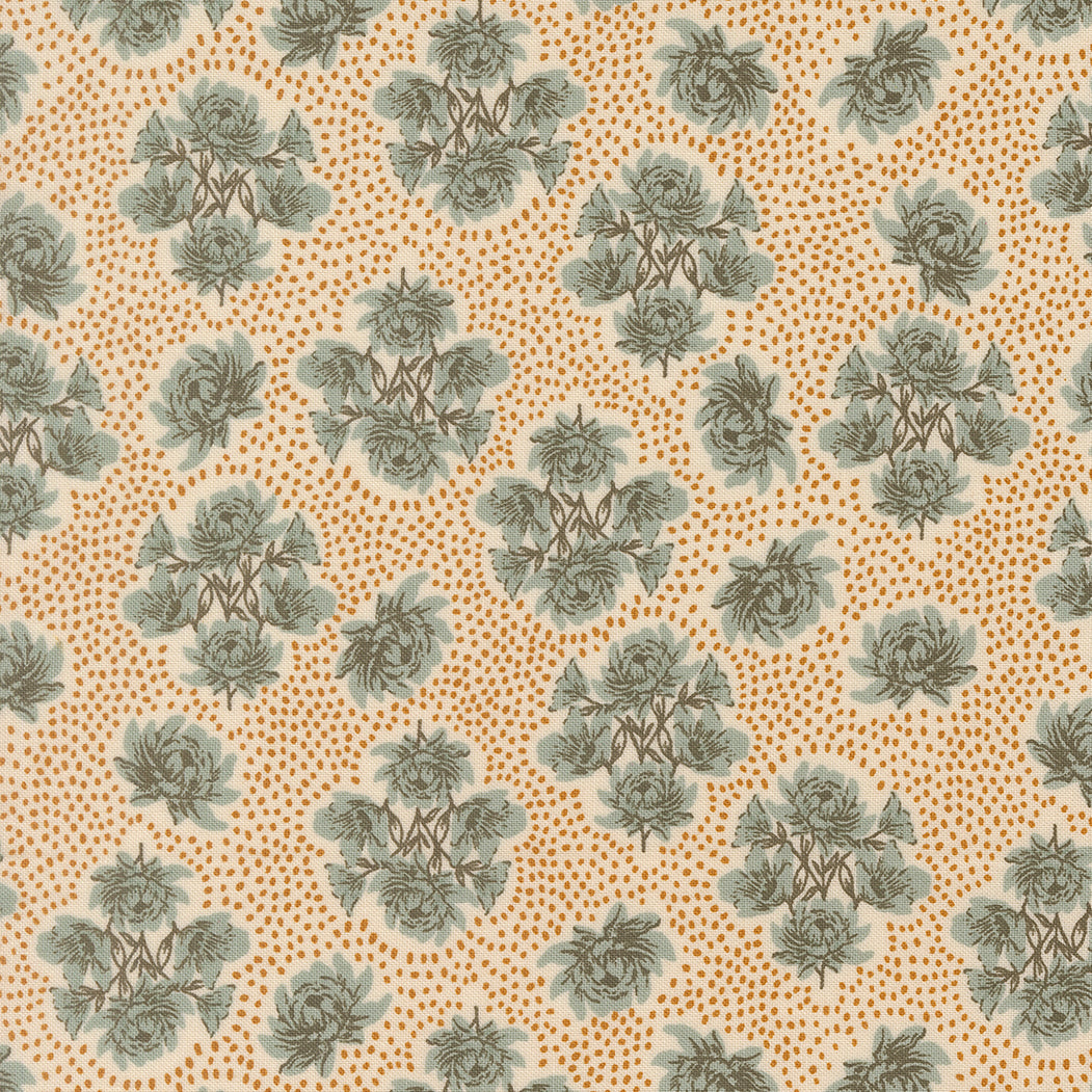 Patterned fabric with green floral design on a beige background